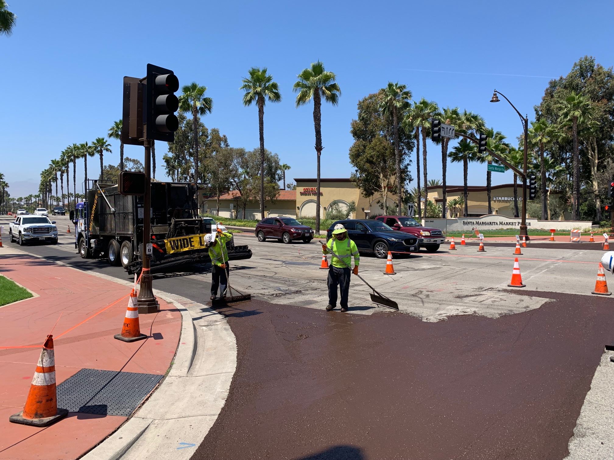 Workers slurry sealing roadways in Rancho Santa Margarita