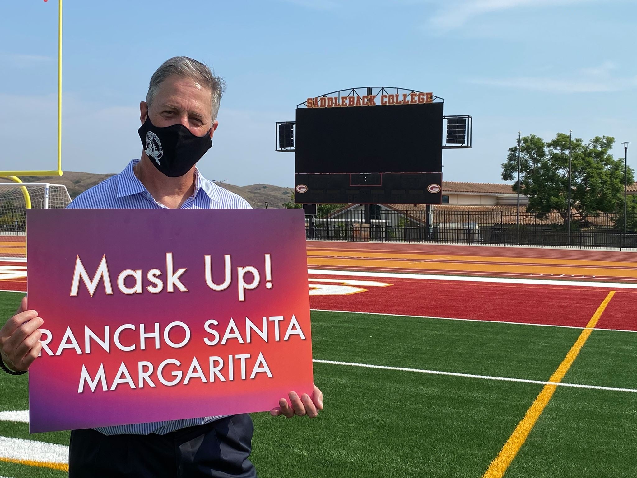 Mayor McGirr holding Mask Up RSM sign 092020
